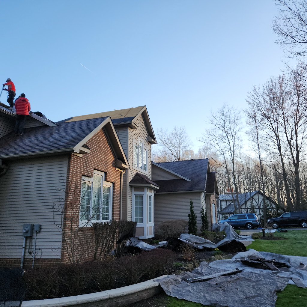 Before hail damage repair in Chagrin Falls showing damaged shingles